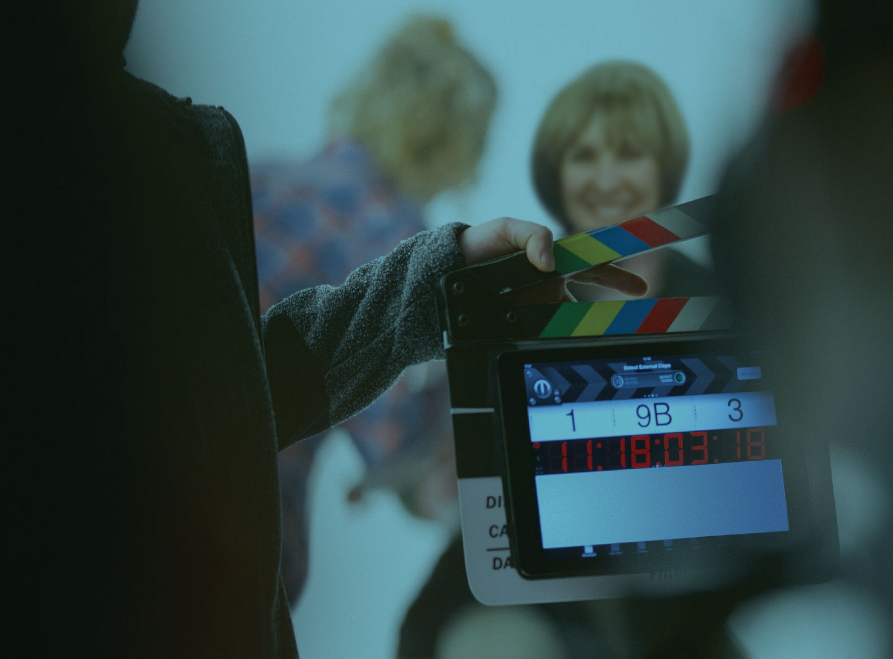 Billie Shepard holding a clapboard
